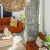 a room with a chandelier and a couch and plants