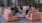 a group of people sitting on a couch in a room with windows