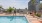 a person walking near a swimming pool